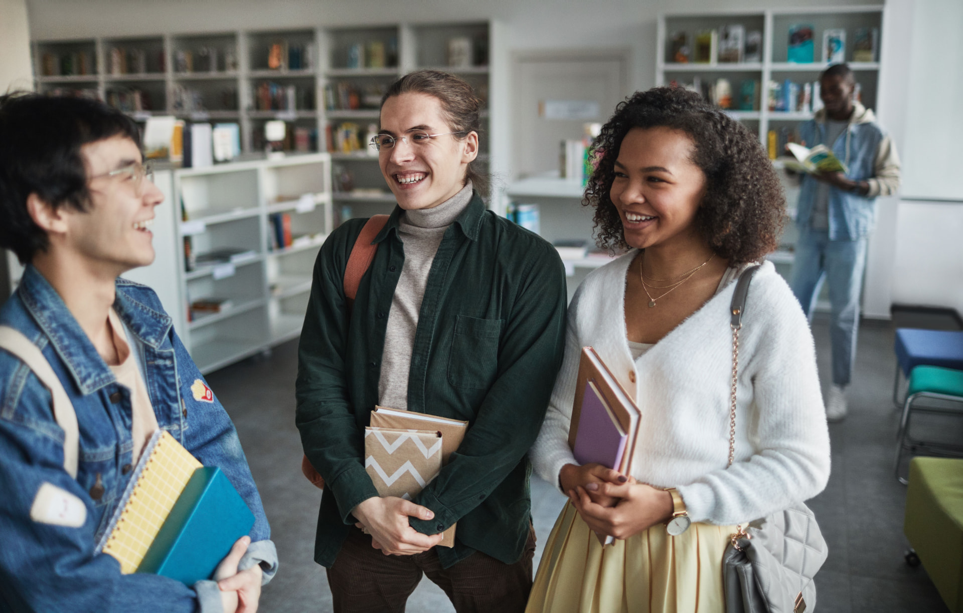 Northwestern students talking together in a library